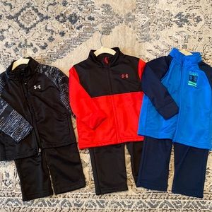 Three Under Armour jacket/pant sets